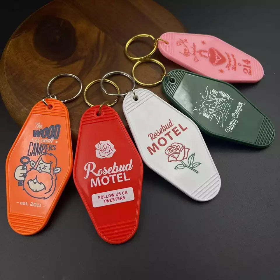 black or white custom motel keychain with gold lettering